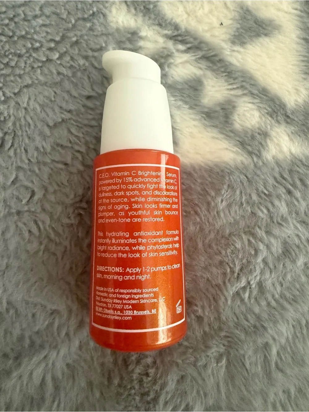 Sunday Riley C.E.O. Brightening Serum in orange and white pump